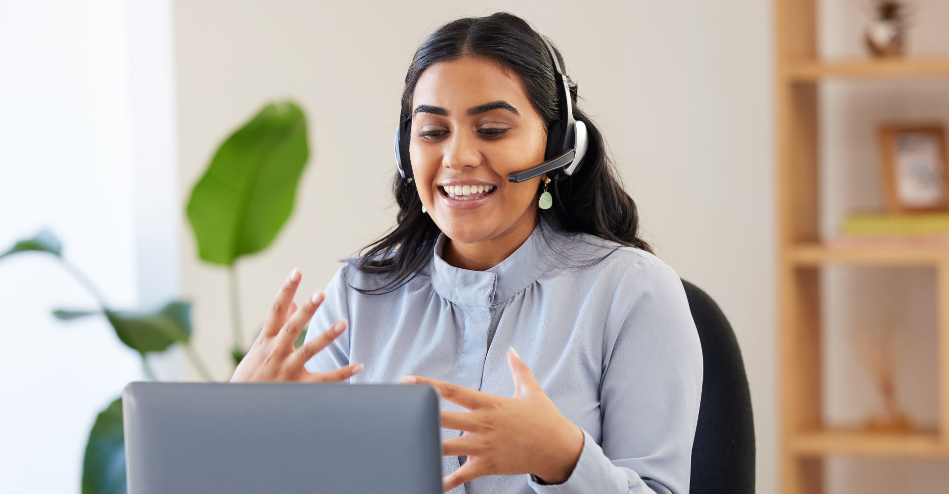 An adult woman engaged learning Spanish online with her Spanish teacher.