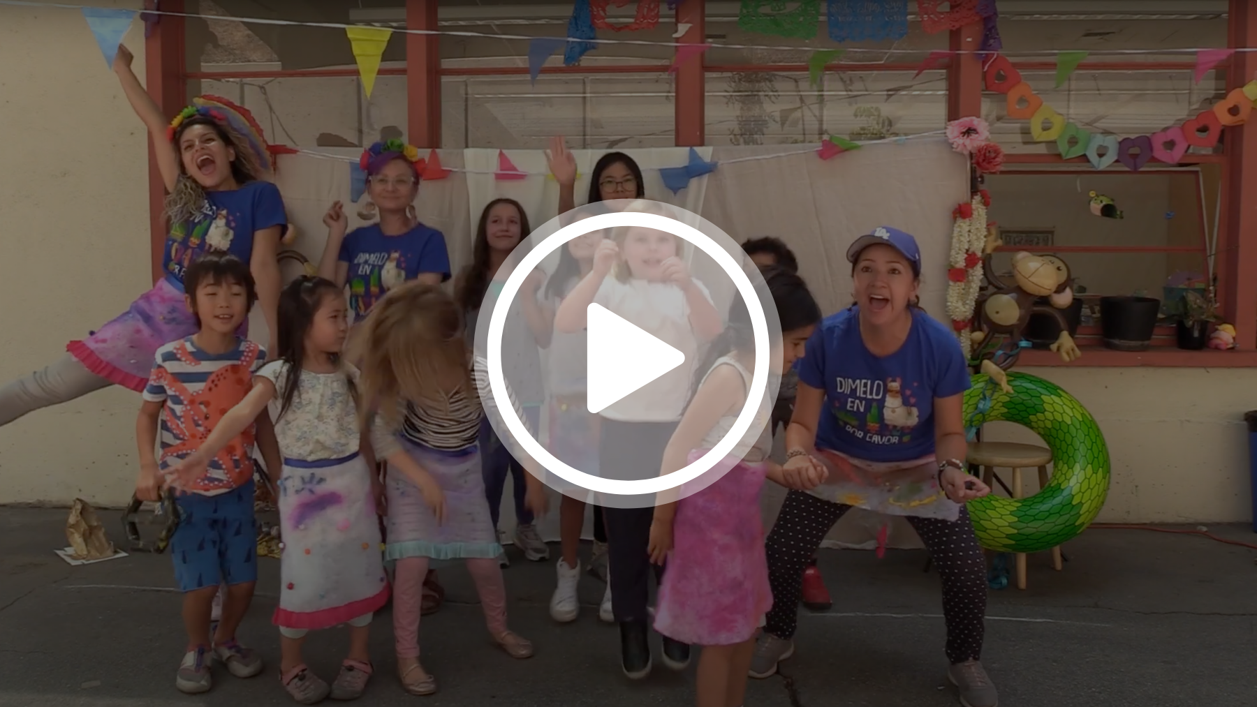 A video still of campers and instructors leaping happily into the air.